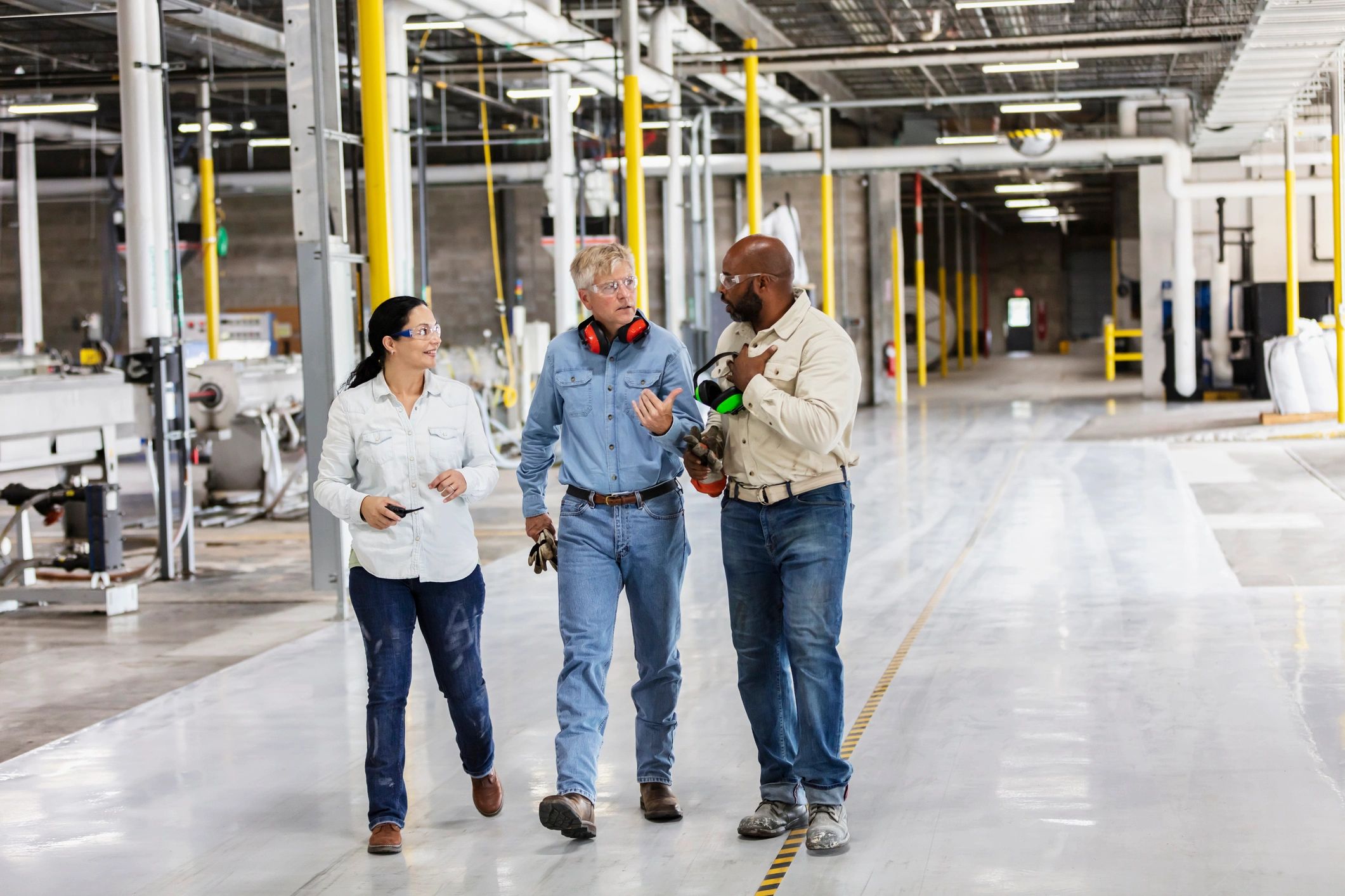 Consulting team walking through an industrial facility