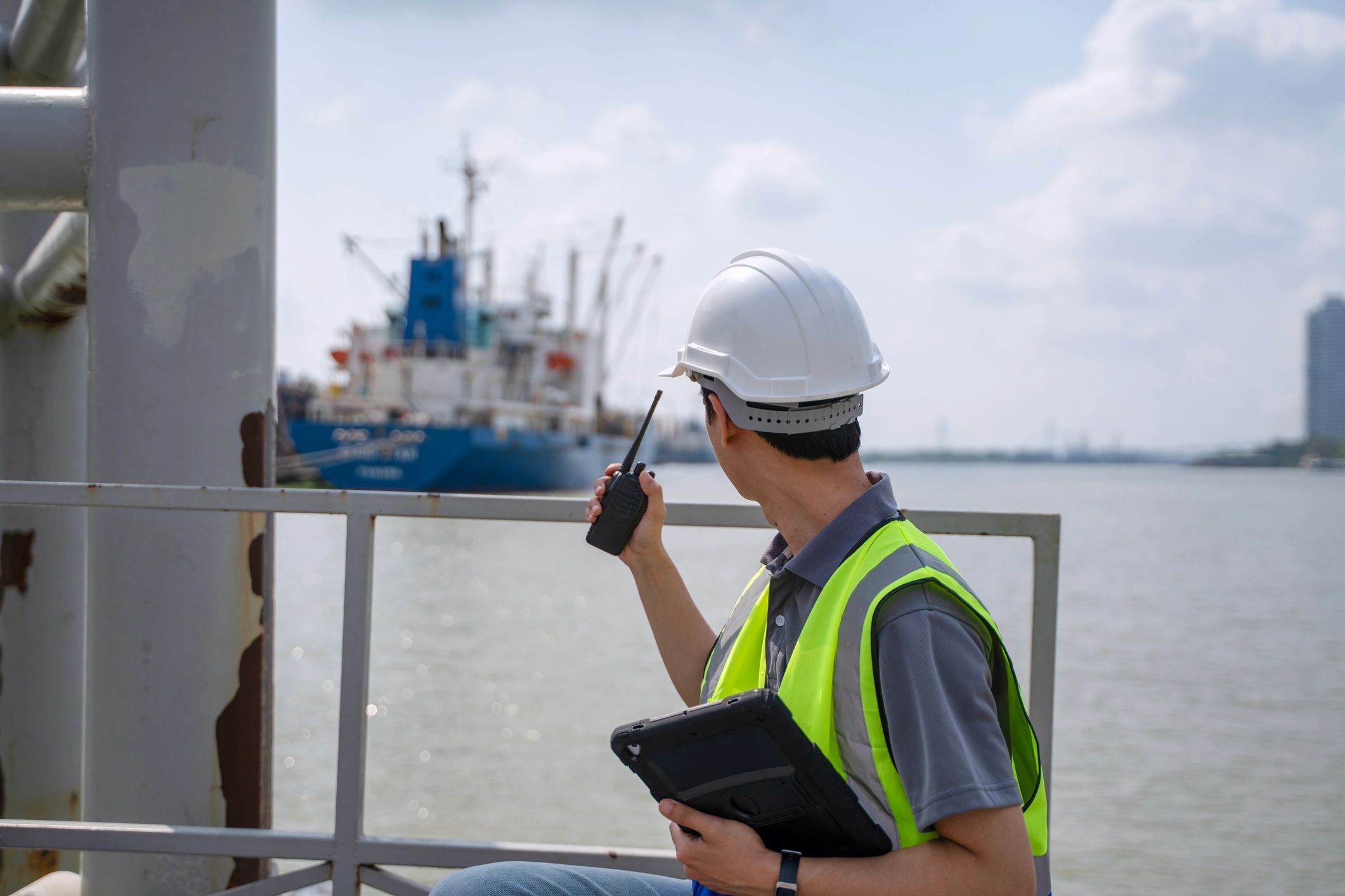 The civil engineer is working with fishing vessel.
